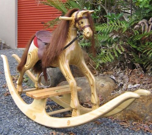 Medium rocking horse, natural on a bow rocker
