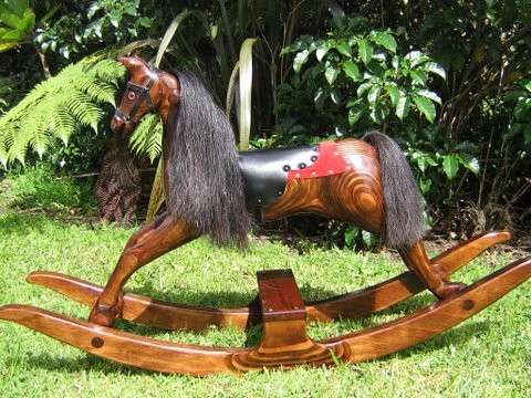 Small amber rocking horse on bow rocker